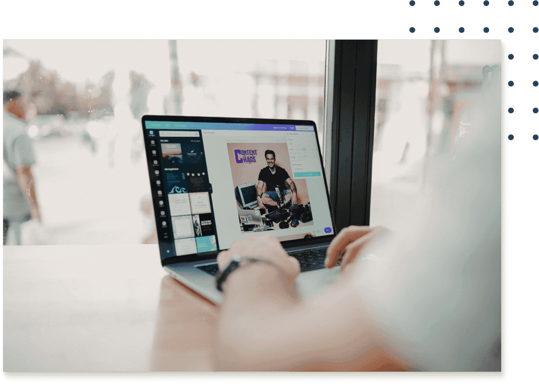 A person sitting at a laptop with Canva open to a project